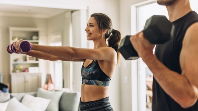 couple-doing-exercises-dumbbell