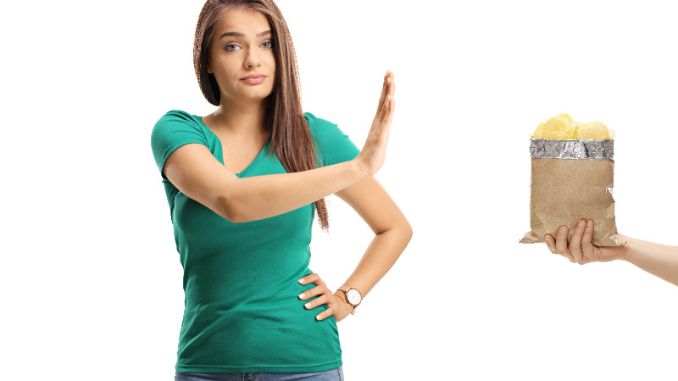 female-gesturing-refusal-hand-to-pack